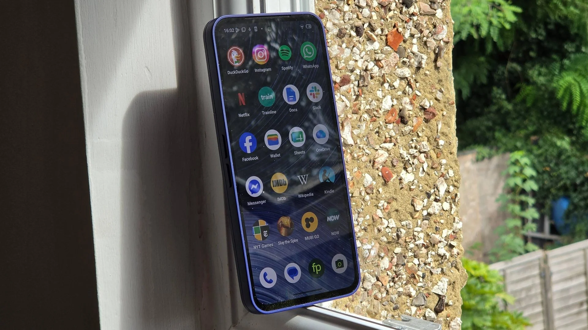 The Fairphone 6 Plus on a window sill.