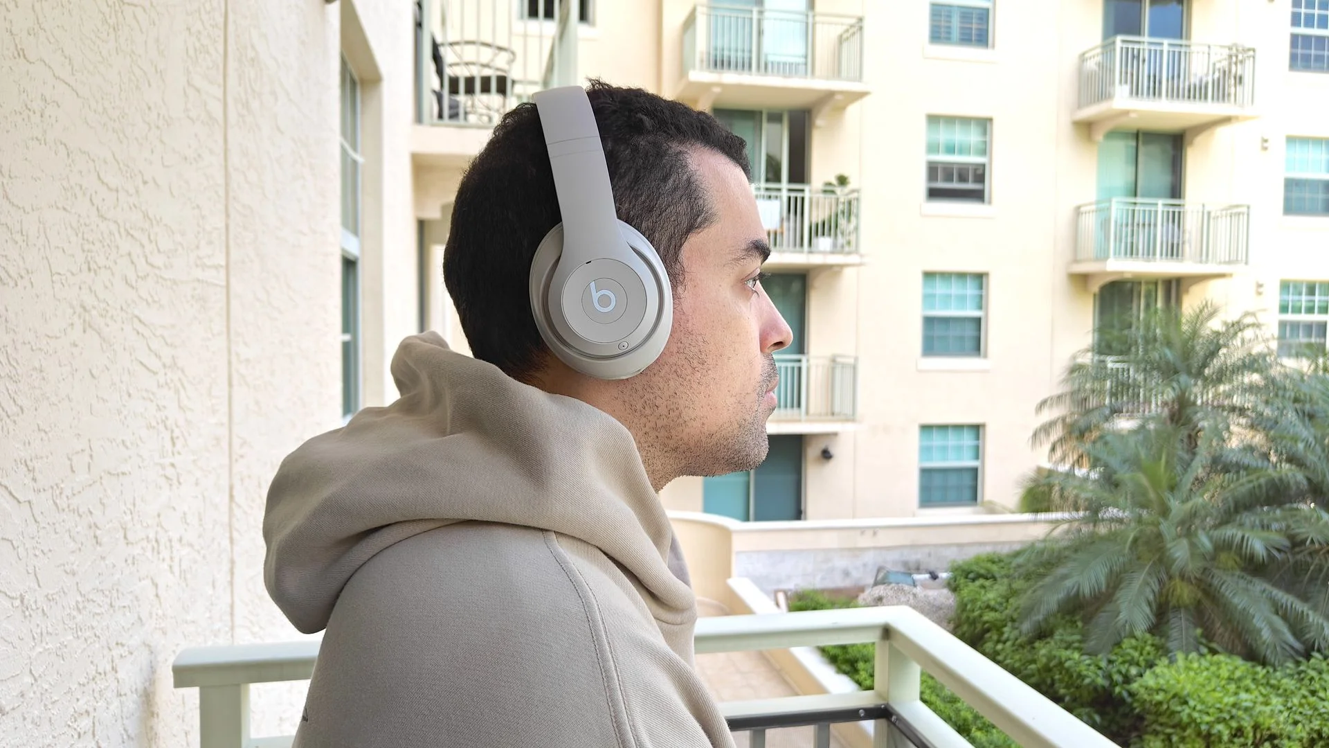 Our reviewer testing the Beats Studio Pro on a balcony