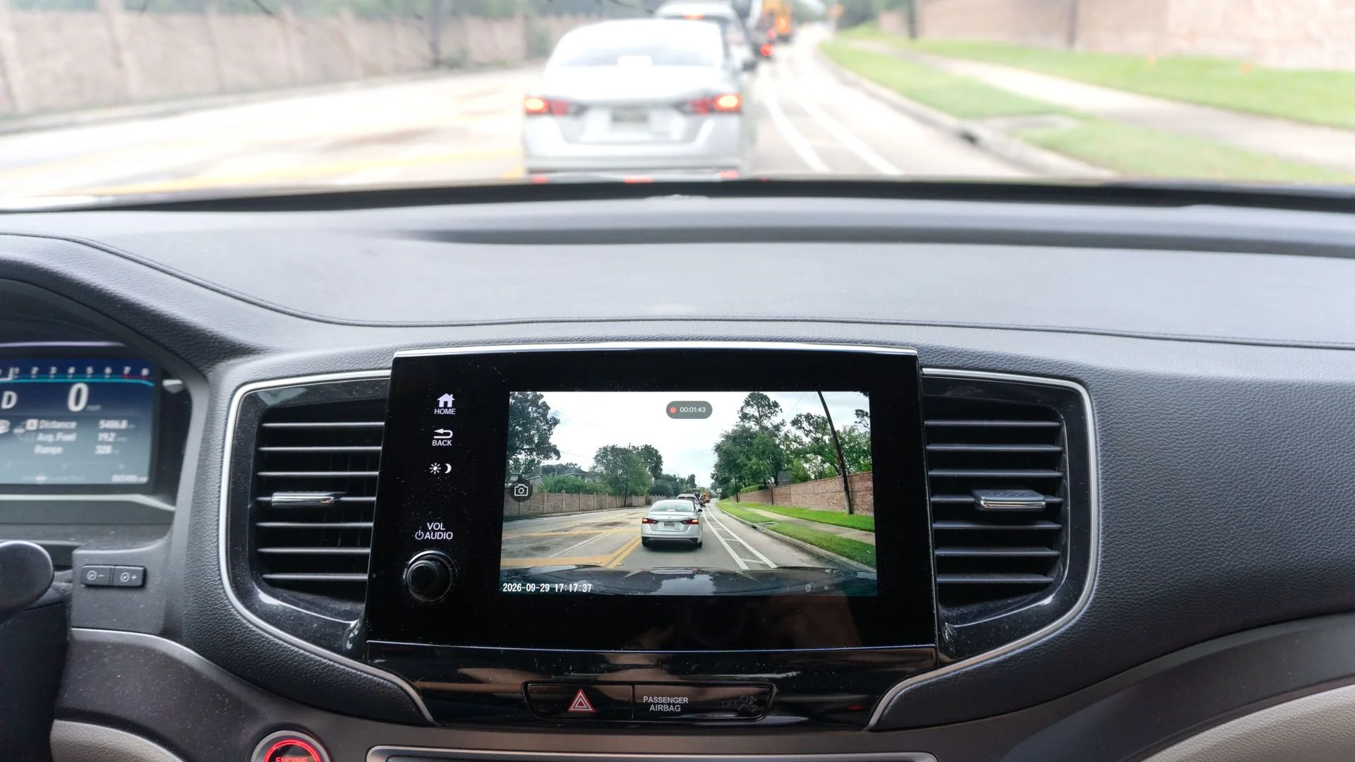 The live feed from the Ottocast OttoSafe Cam dash cam shown on a car's infotainment system