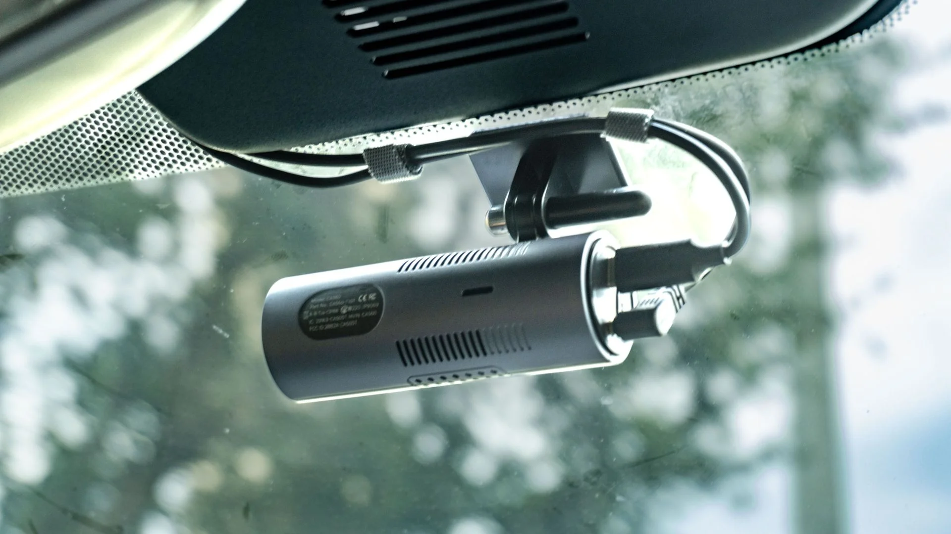 The Ottocast OttoSafe Cam mounted in the center of a car's windshield
