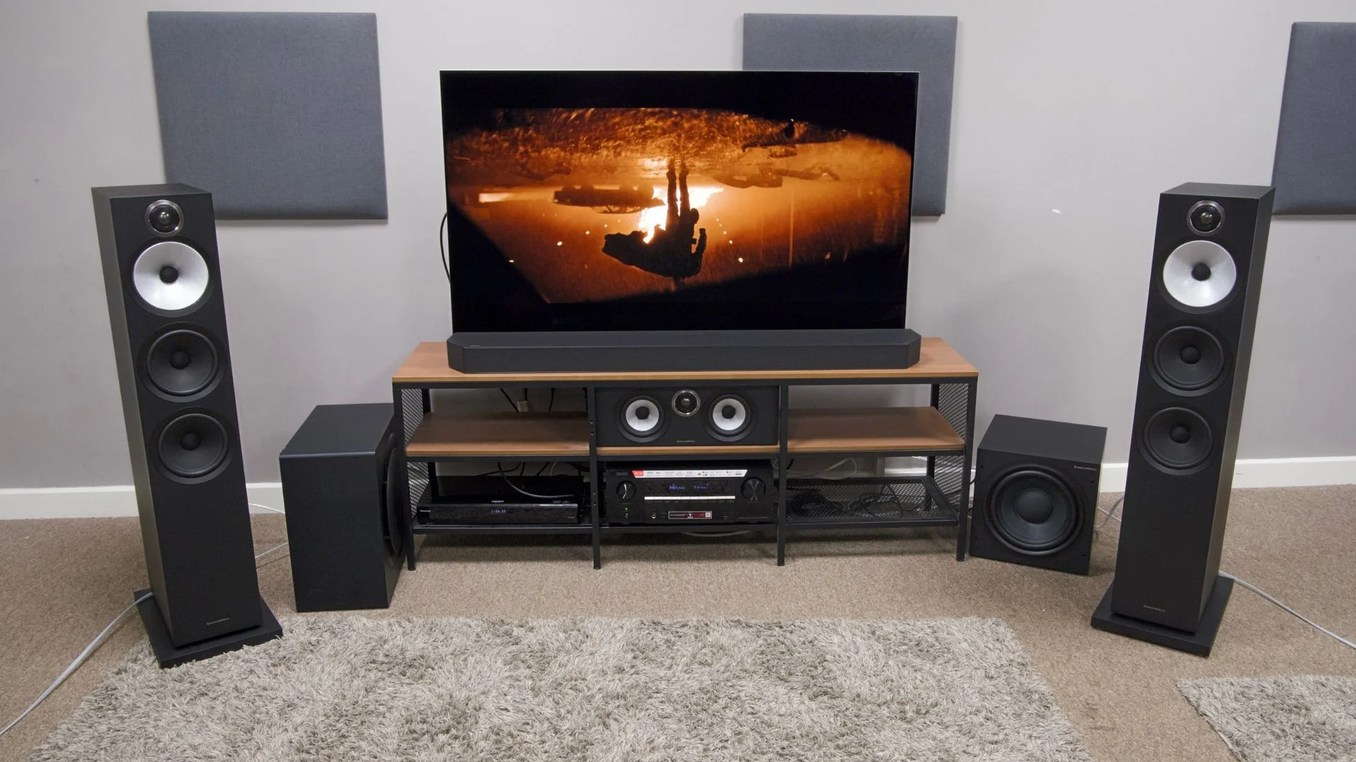 B&W 603 S3 speakers and Denon AVC-3900H and a Samsung HW-Q990C soundbar and subwoofer sat under an LG G6 on a TV stand