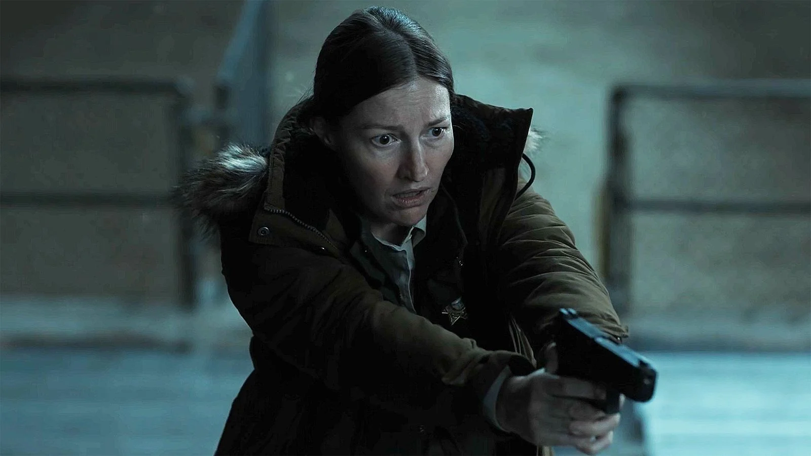 Kerry Kane looking shocked and holding her handgun in the Lanterns season 1 finale